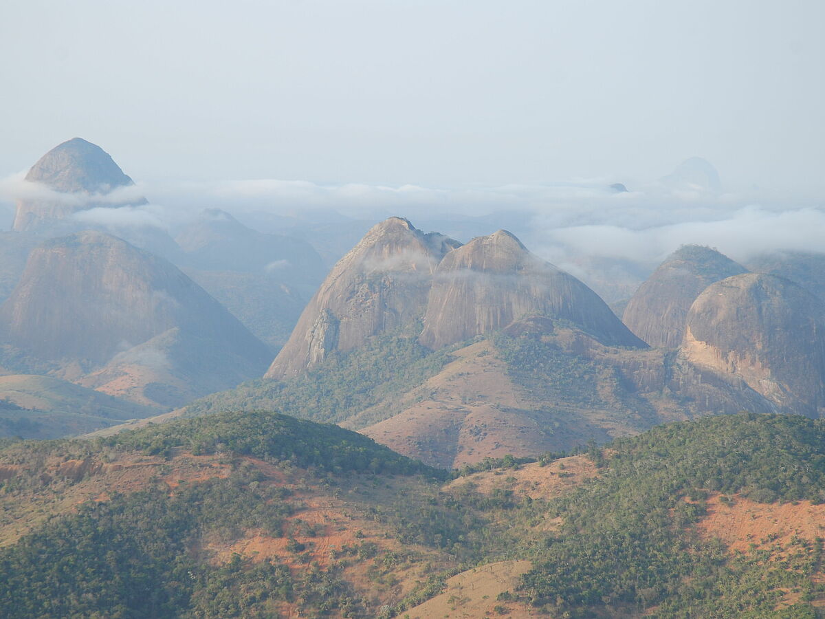 clouds surrounding inselbergs, Pedra da Boca, Brazil